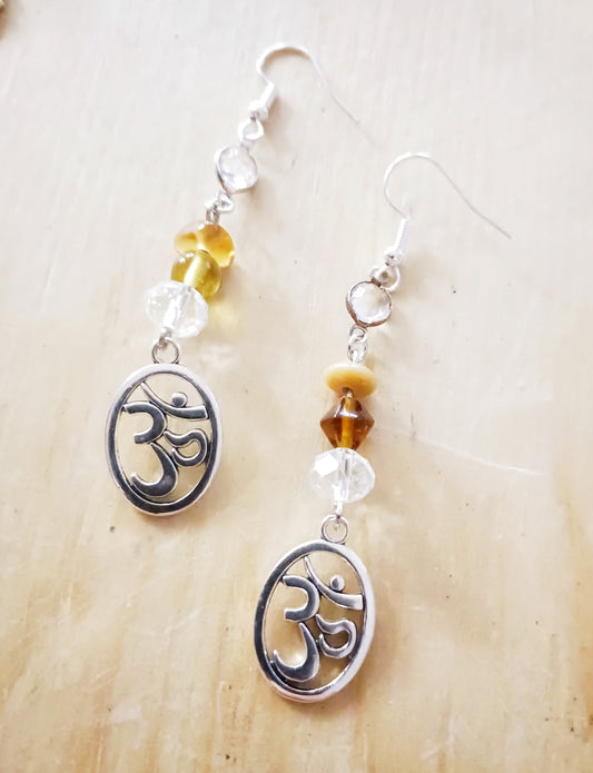 Earrings: Om symbol charm with brown tone beads