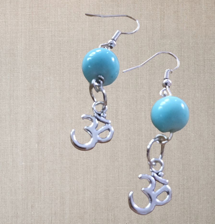 Earrings: Om symbol with blue bead